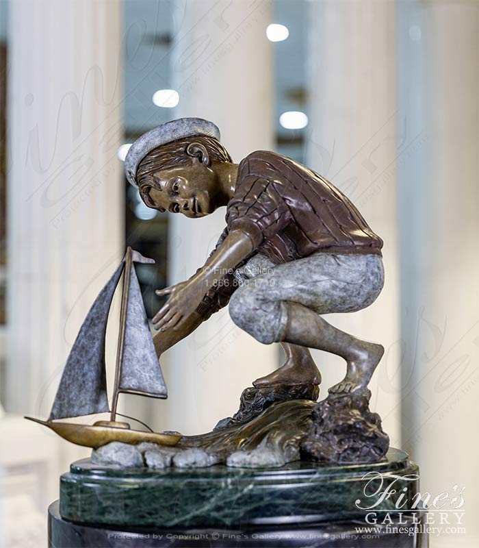 Boy Playing with Sailboat Bronze Statue