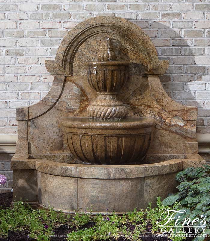 A Tiered Style Wall Fountain in Solid Granite