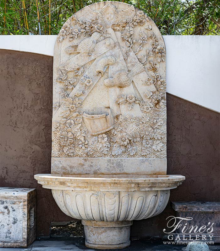 Cherub, Floral and Vine Relief Style Wall Fountain in Miele Verona Limestone